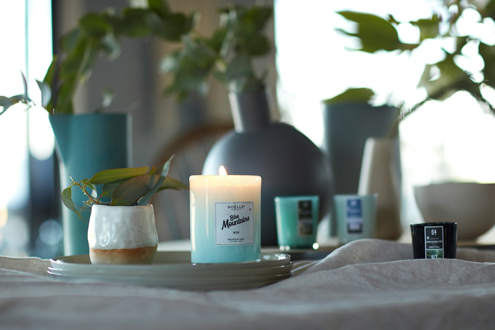 glass candle holder on ceramic plate